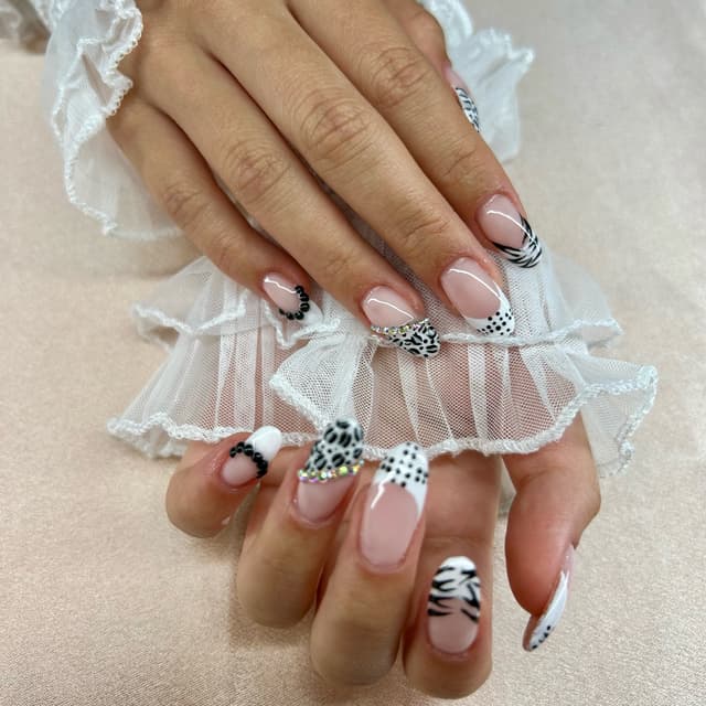 BIAB nails with design a mix of animal print, dots and classy vibes💕