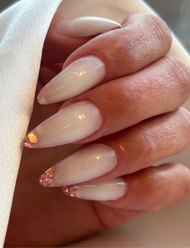Milky white nails with glitter