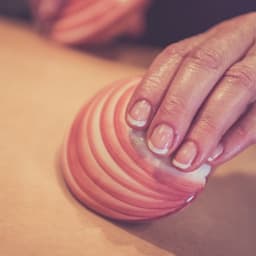 Full body massage using self heating Tiger Clam shells