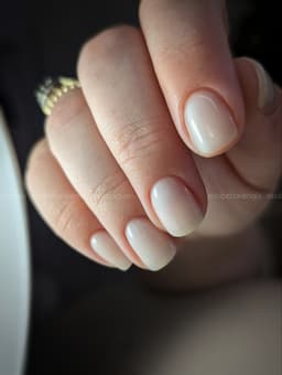 Short natural nails with a soft nude finish – a classic minimalist manicure by MissbehaveNails in Leighton Buzzard.