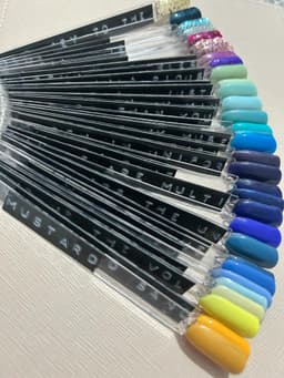 Nail swatches. Glitter, green, blue and yellow.