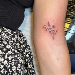Floral fine line tattoo