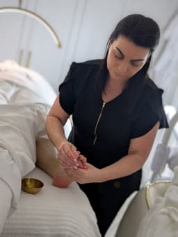 Lower leg massage while face mask is applied