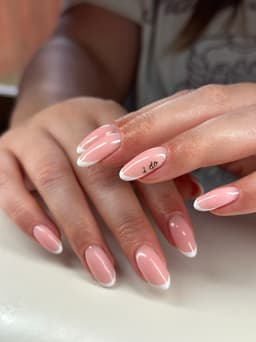 bridal nails: a classic french tip over a builder gel base with a hand painted chrome decal